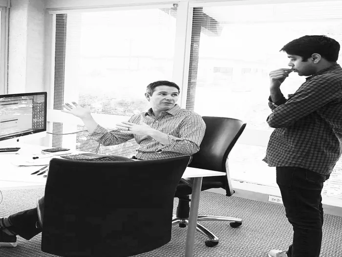 Two campaign staffers reviewing fundraising results together at a desk
